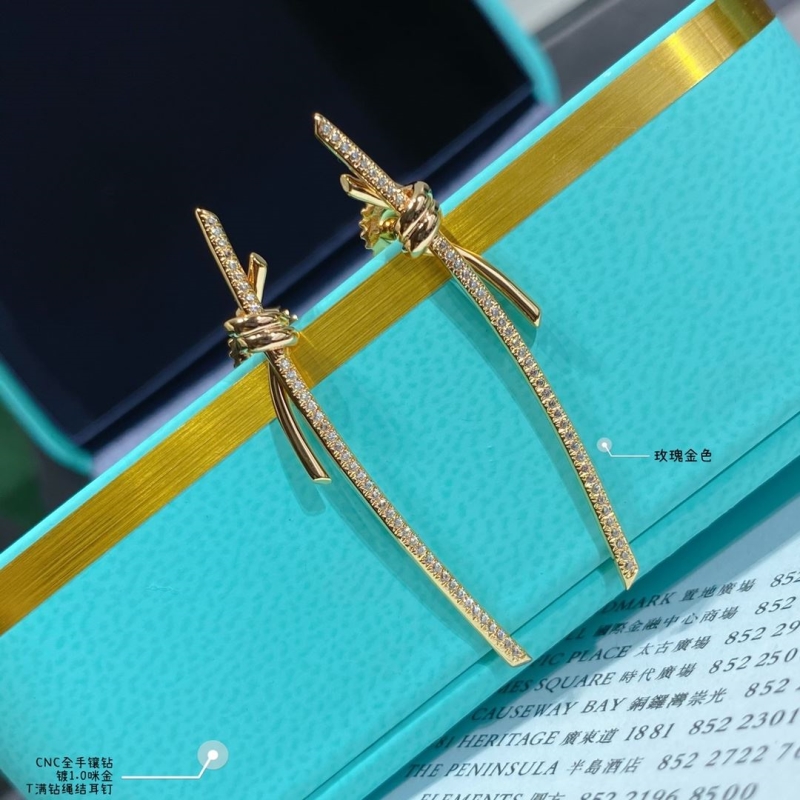 T*f*ny earrings